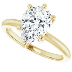 a yellow gold engagement ring with an oval cut diamond in the center and two clawed shoulders