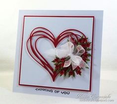 a valentine's day card with a heart and flowers