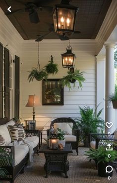 an outdoor living area with wicker furniture and potted plants on the front porch