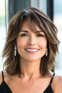 Save this pin for the best medium-length hairstyles for women over 50 with bangs. This choppy layered lob with bangs delivers a stylish, contemporary energy. The uneven layers bring texture to the forefront, giving your hair a vibrant, tousled effect. Medium Layered Haircuts For Me, Medium Hairstyles With Bangs For Women Over 50, Shoulder Length Side Bangs, Haircuts For 50 Year Old Women Over 50, Medium Length Haircut For 40 Year Old, Medium Length Hair With Long Layers And Face Framing Bangs, Beautiful 60 Year Old Women, Haircuts With Short Layers, Haircuts For Medium Length Hair With Bangs