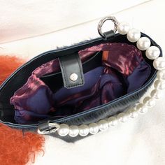 DESCRIPTION:Make a statement and get noticed with our new Fiona Handbag! Unique genuine fur bracelet handbag with pearl handle. Carry on your arm for hands free or hold in your hand. Fully lined with inner pocket. Fun and versatile to dress up a sleek black dress or dress down w jeans and a simple t-shirt; completing your look on an afternoon or night out - even at a wedding! Holds a cell, money, credit cards, glasses, lipstick, keys. • Genuine Italian short fur, Olive Sheepskin or long curly Mo Elegant Rectangular Shoulder Bag With Faux Fur Lining, Chic Shoulder Bag With Faux Fur Lining For Shopping, Elegant Evening Shoulder Bag With Faux Fur Lining, Elegant Evening Bags With Faux Fur Lining, Luxury Faux Fur Evening Bag, Elegant Faux Fur Bags, Elegant Rectangular Faux Fur Bag, Chic Evening Shoulder Bag With Faux Fur Lining, Luxury Evening Bags In Faux Fur