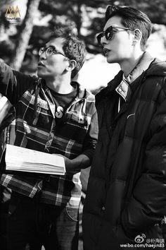 two young men standing next to each other