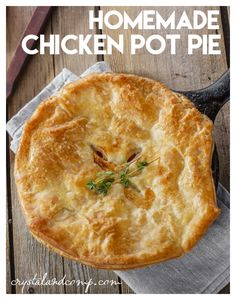 homemade chicken pot pie on a wooden table with text overlay that reads homemade chicken pot pie