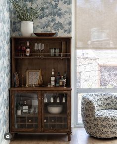 a room with a chair, table and shelves