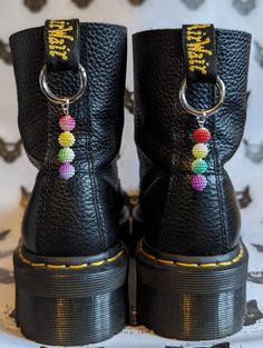 Beautiful handmade rainbow pearl bead boot charms. Perfect for Doc Martens. All boot charms can be purchased as a pair or individually, perfect for mix 'n' matching! Charm dimensions: 0.5cm x 0.5cm Charm length: 4cm drop approximately Boot Accessories Diy, Boot Charms, Boot Chains, Diy Shoe, Rainbow Pearl, Shoe Ideas, Beading Crafts, Bag Charms, Rainbow Beads