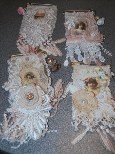 several pieces of lace with pictures on them sitting on the floor next to each other