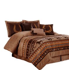 a bed with brown and tan comforters and pillows on top of it's headboard