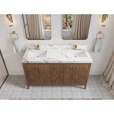 a bathroom with two sinks and mirrors in it