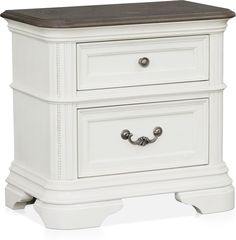 a white night stand with two drawers and a brown top on the bottom drawer,