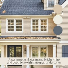 a house with blue and white paint on the front door, window panes above it