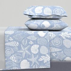 two pillows are stacked on top of each other