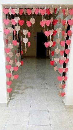 some paper hearts hanging from the ceiling