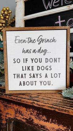 a sign that reads, even the grench has adg so if you don't like dogs that says a lot about you