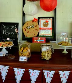 an assortment of snacks and desserts on a table at a children's birthday party