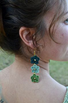 ✺✳ Macrame Stacked Flower Earrings ✳✺ Springtime but make it an earring. These are boho chic to the nines.  * Product Details * Triple stacked macrame flowers with hypoallergenic hooks! The string colors in this stack are ' northern lights ', ' carribean ', and ' mint.' ★ Brass Earth ★ This jewelry is handmade by myself and inspired by my time living in India. All materials are sourced from the friend who taught me this craft 8 years ago! Each piece is woven with intention and love. Green Macrame Earrings As A Gift, Green Macrame Earrings For Gift, Green Macrame Dangle Earrings, Beach Crochet Jewelry In Green, Macrame Flowers, Earrings Macrame, Beach Flowers, Jewelry Beach, Summer Chic