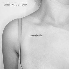 a black and white photo of a woman's chest with the word strength tattooed on it