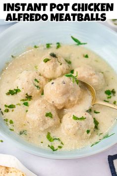 the instant pot chicken alfredo meatballs recipe is in a bowl with a gold spoon