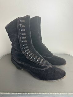 These Victorian Era velvet boots are in excellent vintage condition. All buttons are intact. There are two small repairs at the base of the buttons.  These shoes fit between a 6-7 women's shoe. They are quite narrow and tapered at the end. Please see photos for condition and measurements. Victorian Womens Boots, Victorian Black Boots With Round Toe, Black Victorian Boots With Round Toe, Victorian Black Boots For Formal Occasions, Black Victorian Boots For Formal Occasions, Vintage Formal Boots For Winter, Victorian Boots, Historical Dress, Bullet Bra