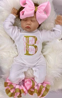 "100% COTTON This adorable customized outfit will have everyone in admiration of your little princess. This customized bodysuit is the perfect outfit for any occasion! Also offers an adorable large handmade ribbon bow with the perfect amount of sparkle and glam! The bodysuit is accented with matching handmade ribbon anklets (which are removable for easy cleaning and style changes, how awesome). The anklets offer the perfect fluffy look for your little one, which we receive endless compliments on Customizable Fitted Onesie For First Birthday, Personalized Fitted Onesie For Birthday, Pink Onesie With Letter Print For First Birthday, Personalized Cute Onesie For First Birthday, Pink Fitted Onesie For Birthday, Pink Cotton Baptism Onesie, White Fitted Onesie With Custom Name, White Custom Name Fitted Onesie, Personalized Pink Onesie For First Birthday