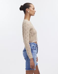 The Qupana Alpaca Cardigan offers an effortless lightweight style with a stylish lace stich. Crafted from breathable alpaca yarn, this button-front cardigan features a crop length that looks great paired with high-waisted pants or skirts. 100% baby alpaca. Handmade in Bolivia. Qupana means: Firefly in Aymara language. Casual Cropped Cardigan With Pointelle Knit, Fitted Pointelle Knit Cropped Cardigan, Fitted Cropped Pointelle Knit Cardigan, Winter Cropped Pointelle Knit Cardigan, Cropped Pointelle Knit Cardigan For Winter, Cropped Open Knit Sweater For Layering, Cropped Pointelle Knit Cardigan For Spring, Cropped Pointelle Knit Cardigan For Fall, Fall Cropped Open Knit Cardigan