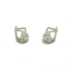 Sterling silver earrings with 3.5mm round CZ - E000652. Stamped 925. Approximate weight 1.2 grams. Dimensions 1.0x0.7cm (0.40x0.28inches). All our jewels are made from solid sterling silver 925/1000 and are carefully crafted by hand in our family workshop. We dispatch your orders in 5 working days, worldwide and the postage is $5. We ship registered priority mail. Please allow 5-7 working days for delivery in Europe and 10-15 working days outside Europe. For any questions - please do not hesitat Silver Sterling Cluster Earrings With Prong Setting, Silver Huggie Earrings With Cubic Zirconia, Silver Huggie Diamond Earrings, Pierced, Silver Pierced Huggie Diamond Earrings, Silver Sterling Huggie Earrings With Prong Setting, Silver Dainty Cluster Earrings, Silver Huggie Earrings With Prong Setting In Sterling Silver, Dainty Silver Diamond Earrings For Formal Events, Dainty Sterling Silver Huggie Earrings For Formal Events