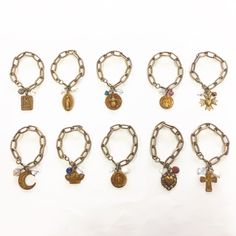 Tarnished Brass Link Charm Bracelets. Choice of charms include Saint Christopher, Madonna, Honey Bee, Guardian Angel, Sacred Cross, Moon,Crown,Mother Mary,Filigree Heart, or Holy Family Cross. In addition to the charm, each bracelet is adorned with a crystal and assorted bead. 7 1/2 " in length. Pick your favorite or buy several to stack on your wrist! Moon Crown, Filigree Heart, Saint Christopher, Holy Family, Mother Mary, Guardian Angel, Honey Bee, Charm Bracelets, Link Bracelets