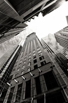 looking up at tall buildings in the city