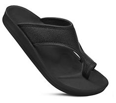 Elevate your beachwear or casual ensembles with these sleek slip-on sandals boasting sturdy straps and supportive soles. From Aerothotic. Comfortable Slip-resistant Sandals For Beach, Beach Sport Sandals With Arch Support And Open Toe, Open Toe Sport Sandals With Arch Support For Beach, Slip-on Slip-resistant Sandals For Vacation, Vacation Slip-on Slip-resistant Sandals, Lightweight Black Sandals For Beach, Lightweight Black Sandals For The Beach, Comfortable Beach Sandals With Arch Support, Comfortable Black Sport Sandals For Beach