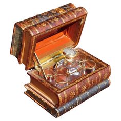 an old fashioned box with glasses in it