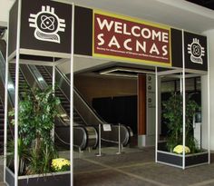 an entrance to a building with plants and stairs