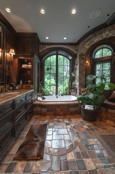 a large bathroom with stone floors and windows