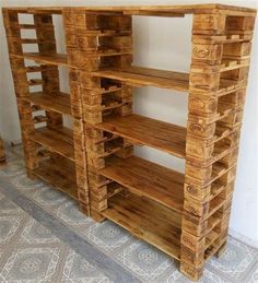 a wooden shelf made out of pallets on the floor