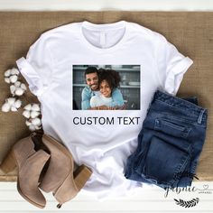 Collaborate with our designers to create your unique and personalized t-shirt. We have over 100s of fonts, graphics, and colors to choose from. You can even send in your own photos! This is a collaborative experience, you will receive mockups along with way for approval. We ask that you have a basic idea of what you want in mind (i.e.- kind of graphics, words, position of text and/or graphics, etc.) but we are willing to collaborate with you along the way to make sure you receive the perfect cus Customizable Short Sleeve T-shirt With Sublimation Design, Custom Print Short Sleeve T-shirt, Custom Graphic Print Sublimation Short Sleeve Shirt, Custom Print Crew Neck T-shirt For Customization, Custom Print Cotton T-shirt For Customization, Cotton T-shirt With Custom Print, Customizable Short Sleeve Graphic Tee With Sublimation Design, Custom Text Short Sleeve Tops, Custom Text Crew Neck Shirt For Customization