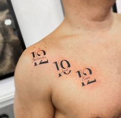 a man's chest with numbers on it and the date taken from his birth