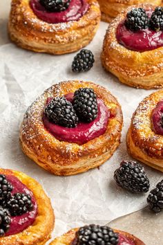 some very tasty looking pastries with berries on them