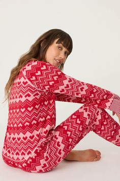 Bring festive charm to your holiday loungewear with this vibrant red jammie set, featuring a thermal velour top and banded PJ pants with an ivory fair isle heart print. The silky velour fabric and winter-themed design make this set a cozy yet stylish option for holiday mornings, ski trips, or relaxed winter evenings. It’s the perfect way to add a festive flair to your pajama collection this season. Pajama Collection, Holiday Loungewear, Ski Trips, Velour Top, Holiday Morning, Velour Tops, Velour Fabric, Winter Themed, Pj Pants