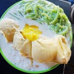 a green and white plate with food on it