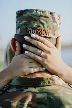 Military engagement ring photo with last name in military uniform. Army Engagement Pictures, Military Family Photoshoot, Army Engagement Photos, Navy Military Weddings, Military Family Pictures, Military Wedding Army, Army Couple Photography, Military Family Photos, Military Couple Pictures