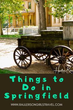 an old wagon with the words things to do in springfield on it and a tree