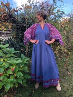 Vintage 70s Indian maxi dress. Blue cotton full length dress with red blue wood block printed angel sleeves. Boho, Hippie dress. Made of flowing heavyweight partly faded blue cotton fabric, sleeves made of block printed cotton fabric. Small defects on the pits, already fixed (see on last photo) To fit size S/M/L Bust 39" 99cm Length 55,5" 141cm Indian Maxi Dress, Indian Maxi, Maxi Dress Boho, Hippie Dress, Angel Sleeves, Full Length Dress, Blue Wood, Hippie Dresses, Dress Boho