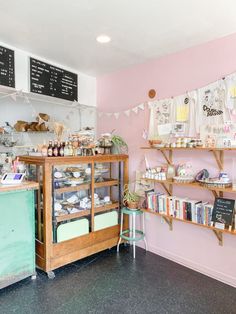 the inside of a small bakery with lots of shelves