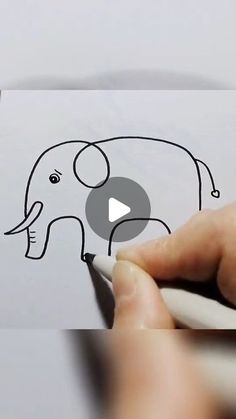 someone is drawing an elephant with a marker