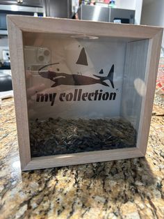 a photo frame with an image of a shark and the words my collection on it