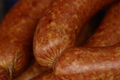 several sausages are stacked on top of each other in this close up photo,