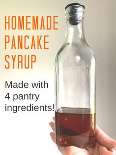 someone is holding a homemade pancake syrup in a glass bottle with the words made with 4 pantry ingredients