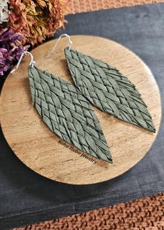 Leather ♡ Braided ♡ Green  Sage Green chevron textured leather earrings, genuine leather, 3 inches long, extremely lightweight. Lead and nickel free hooks with rubber backs. Leather Feather Earrings, green leather earring, cozy earrings, sweater earrings, western earring, gifts for her, forest green boho earring Green Leather Dangle Earrings, Green Leather Dangle Jewelry, Handmade Rustic Green Earrings, Rustic Handmade Green Earrings, Western Earring, Sweater Earrings, Leather Feather Earrings, Earrings Western, Boho Earring