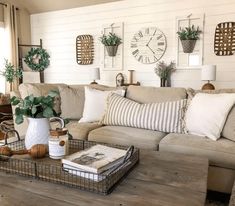 a living room filled with lots of furniture and decor on top of a wooden table