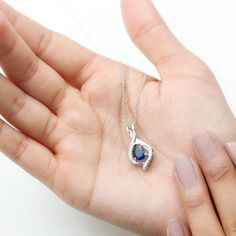 Product Details Enhance your style with the alluring charm of this Teardrop Pendant, designed to captivate and fascinate. The pear-shaped Created Blue Sapphire, held securely in place by a prong setting, adds a touch of mesmerizing beauty to your look. The teardrop design of the necklace features Moissanite accents, not only enhancing its elegance but also providing protection against negative energies. Product Information SKU SHP-PENDANT052310143 Weight 4.40 gm (Approximate) LAB CREATED BLUE SA Mesmerizing Beauty, Signature Jewelry, Teardrop Pendant, Timeless Jewelry, Conflict Free Diamonds, Free Jewelry, Pear Shaped, Prong Setting, Blue Sapphire