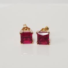 "Thanks for shopping our vintage estate store. We tend to sell well below wholesale and truly hope you enjoy all of our items. Many of the items are one of a kind, so please enjoy scrolling through the pictures and hopefully something will catch your eye. Brown spots are from camera or reflections. Nice estate 10k yellow gold lab created 4ct ruby princess cut studs. Size: 1/4\" 7mm Weight: 2.20 grams Gems: 2ct each Marked 10k and these are nice. Lab created. Backs are 14k." Luxury Lab-created Ruby Earrings For Gift, High-quality 14k Gold Earrings For Anniversary, Vintage Earrings With Prong Setting, Classic 14k Stamped Earrings For Anniversary, Vintage 14k Stamped Earrings As Gift, Vintage High Quality Jewelry For Formal Occasions, Classic Prong Setting Earrings Gift, Classic Prong Setting Earrings For Gifts, Classic Earrings With Prong Setting As Gift