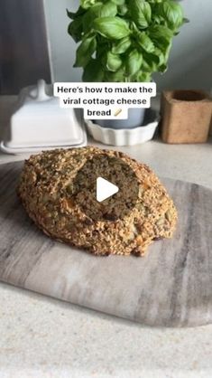 a video demonstrating how to make the virtual cottage cheese bread with basil in the background